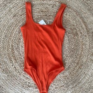 NWT Orange Ribbed Bodysuit